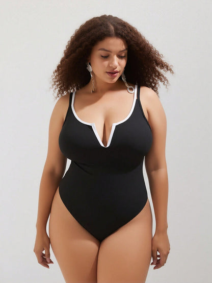 Vacation Style Plus Size One-Piece: Minimalist Black Design For A Timeless Beach Look