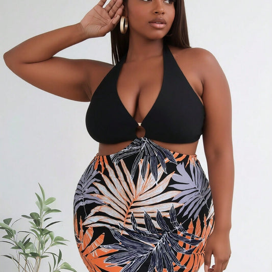 Women's Vibrant Plus Size One-Piece: Black Halter Top with O-Ring and Tropical Palm Leaf Print Skirted Bottom