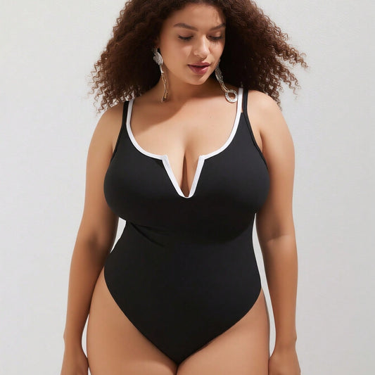 Vacation Style Plus Size One-Piece: Minimalist Black Design For A Timeless Beach Look