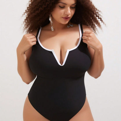 Vacation Style Plus Size One-Piece: Minimalist Black Design For A Timeless Beach Look